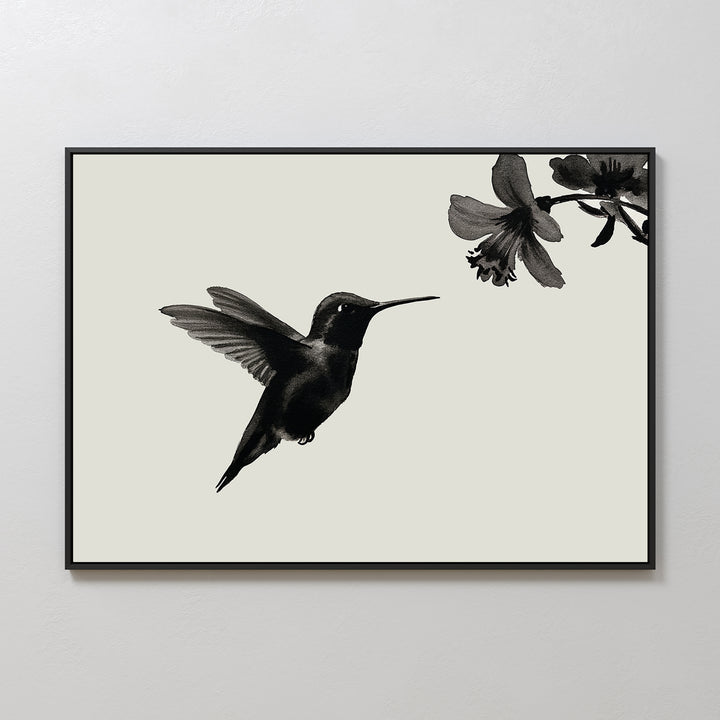 Hummingbird Motion Canvas Art: Minimalist wall decor showcasing a black hummingbird near a flower on a light background, framed with a sleek black border—ideal for modern spaces.