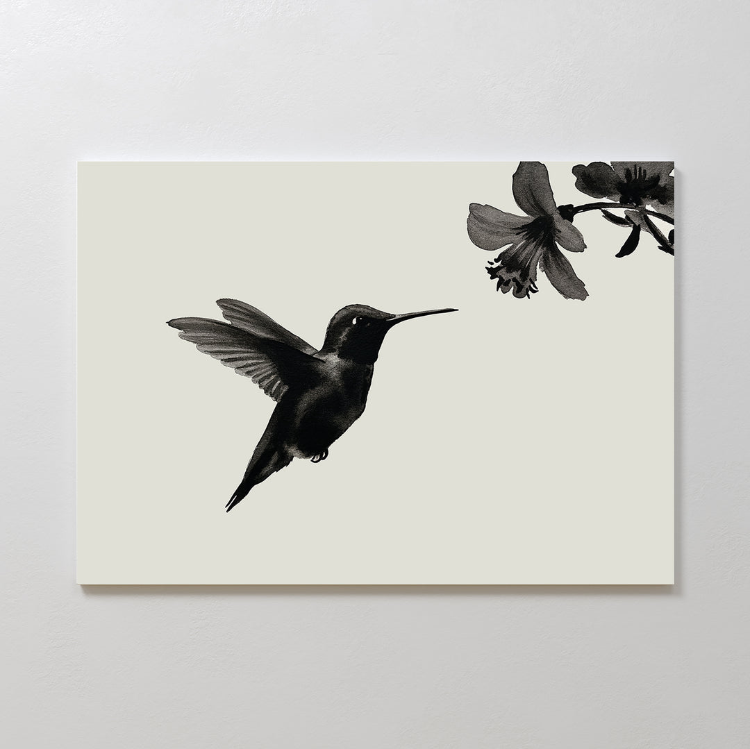Hummingbird Motion Canvas Art: A minimalist black hummingbird print on a light background shows the bird mid-flight near a flower—ideal for sleek, modern decor.