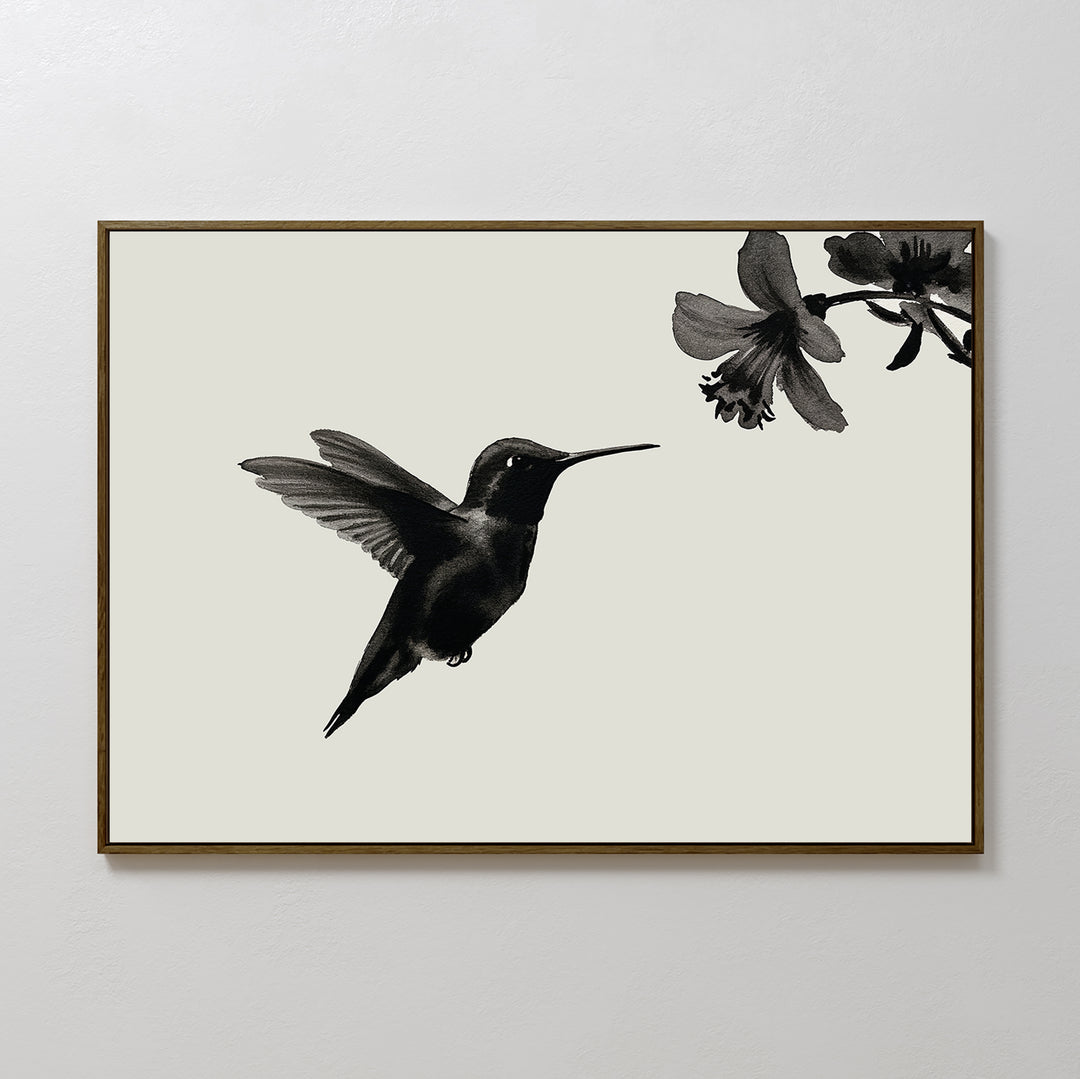 Hummingbird Motion Canvas Art features a sleek black hummingbird hovering near a flower on a light background, set in a thin brown frame—ideal minimalist wall decor for modern spaces.