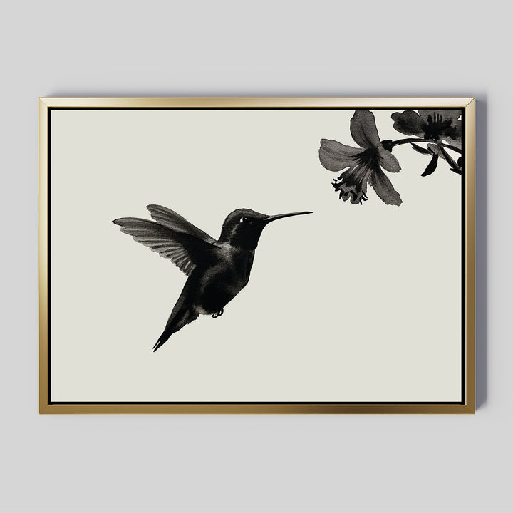 The Hummingbird Motion Canvas Art features a black hummingbird print on a minimalist black-and-white background, elegantly framed in thin gold—ideal modern decor or minimalist wall art for your light gray space.
