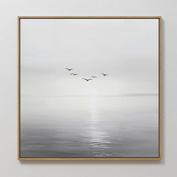 Into the Light Canvas Art features a minimalist calm sea with gentle waves, a bright horizon, and six birds in soft grayscale tones. This large piece comes framed with a thin wooden border—ideal for contemporary living room decor.