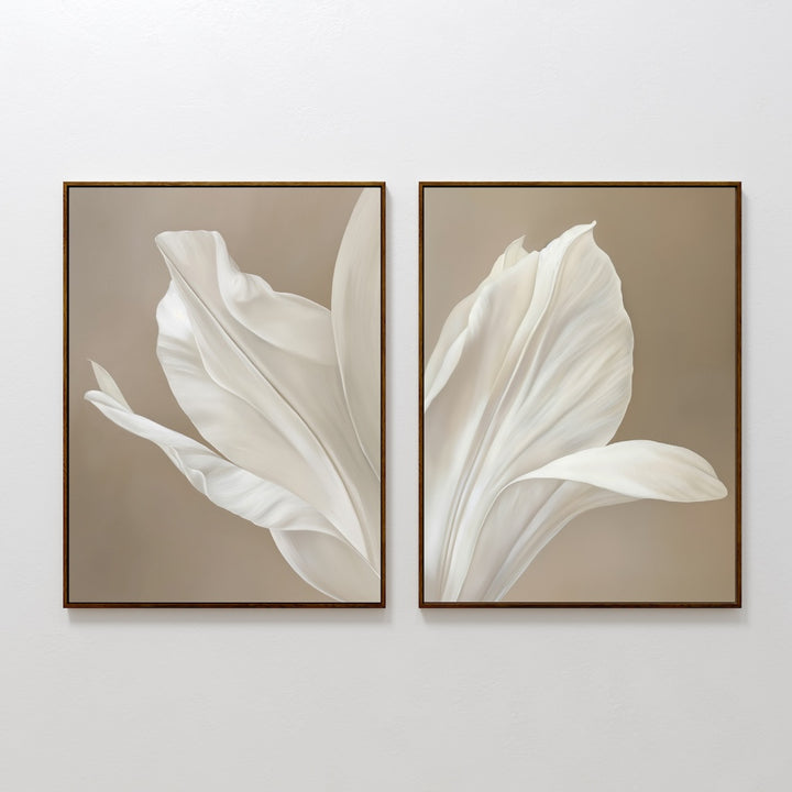 The Ivory Petals Set of 2 features framed prints with elegant white flower petals on a soft beige background, displayed side by side—an ideal minimalist wall art choice to elevate your living room decor.