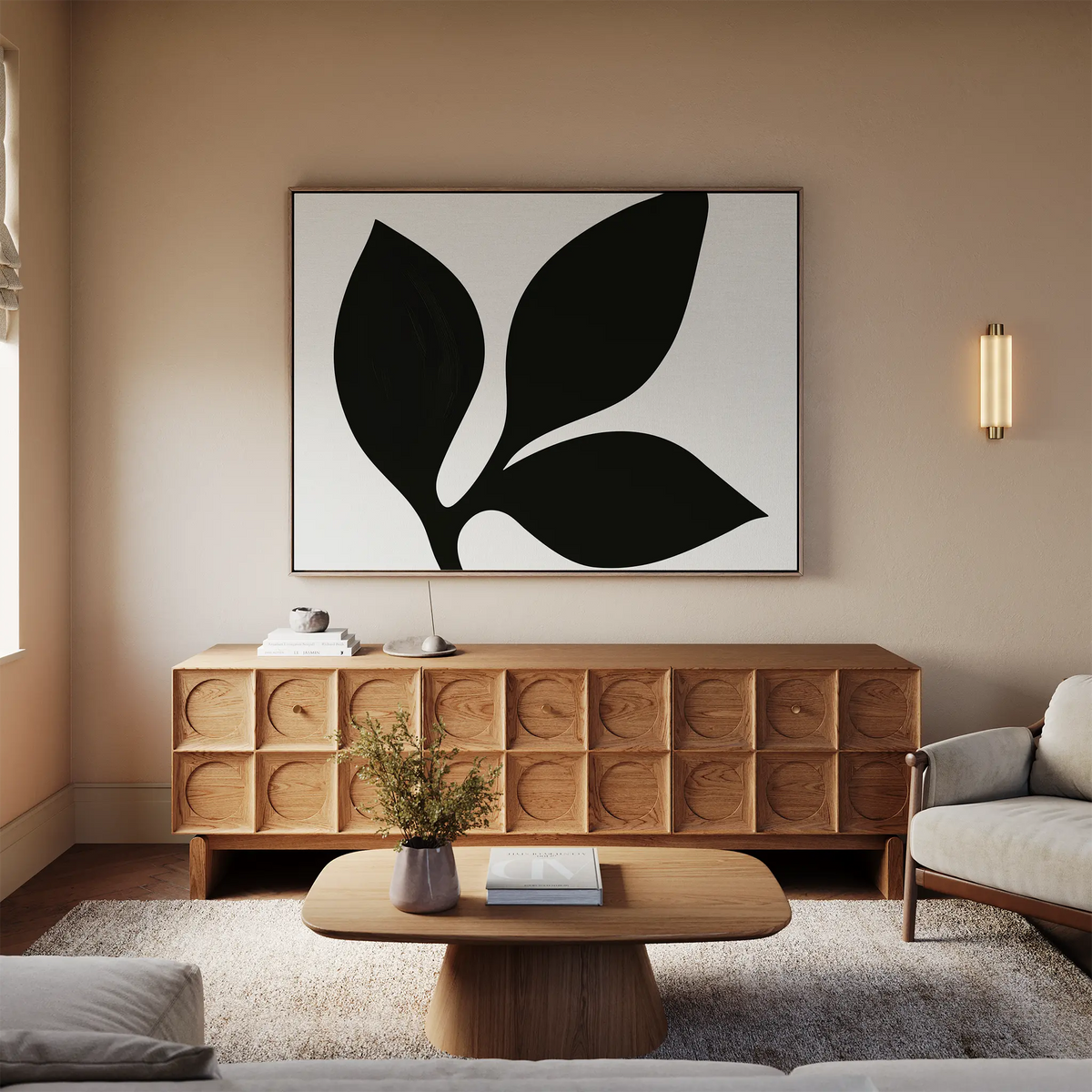 A modern living room with a light sofa, wooden coffee table, patterned sideboard, and the Midnight Botanist Canvas Art above—plus a small vase of flowers—all in neutral, earthy tones for effortless decor.
