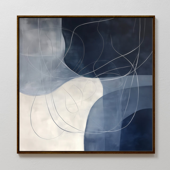 Midnight Lines Abstract Canvas Art features curved white and blue shapes with flowing lines on a dark blue and white background. Framed in dark wood, this elegant piece is a striking focal point for modern living room decor.