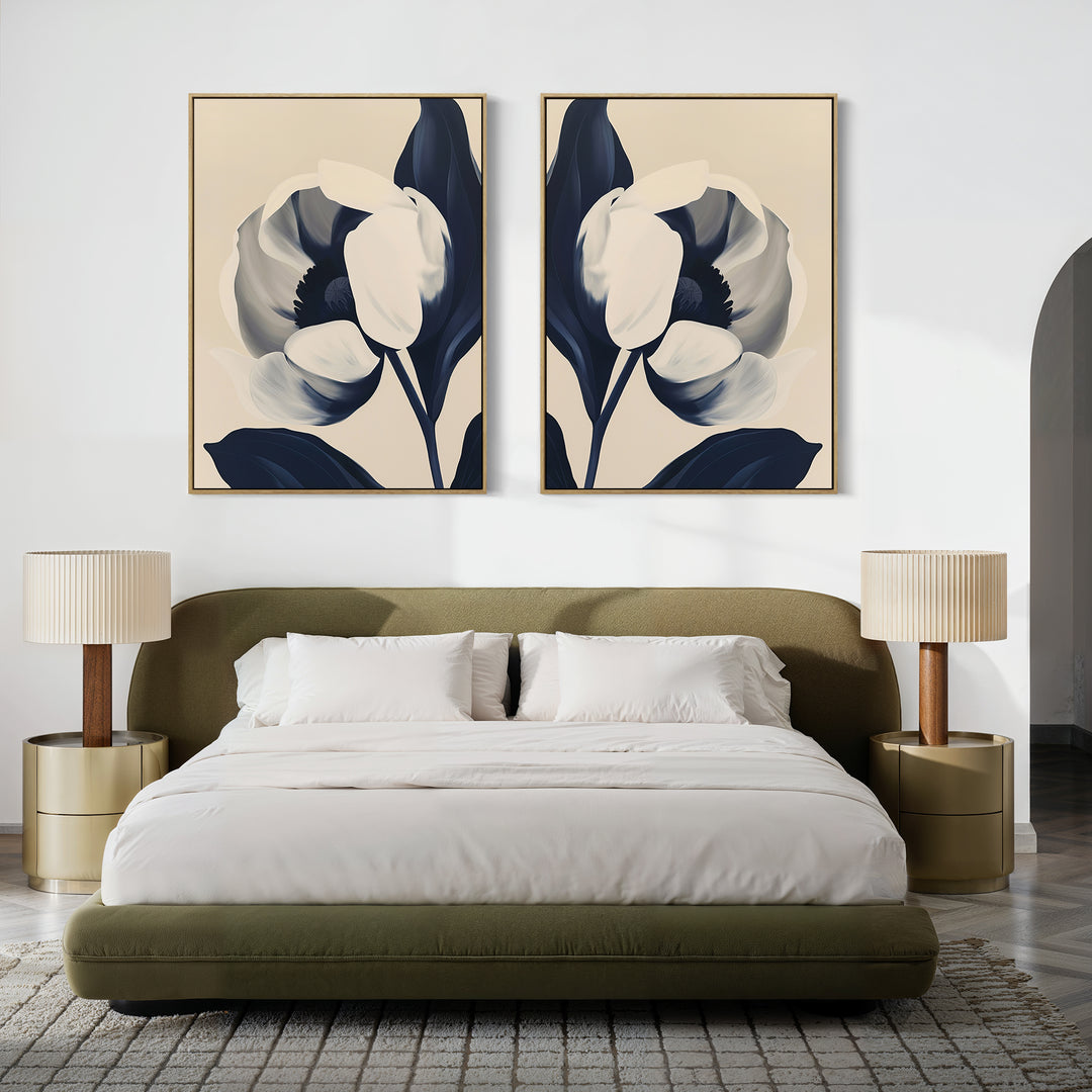 A modern bedroom with a low olive green bed, white bedding, matching round nightstands, two beige lamps, and the Midnight Tulip Set of 2 botanical wall art above the headboard on a white wall.