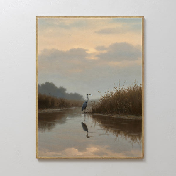 The Misty Reflection Canvas Art features a heron standing in shallow water at sunset, surrounded by grasses and trees. Soft clouds and muted colors create a peaceful scene, making it perfect wall art for a calming atmosphere.
