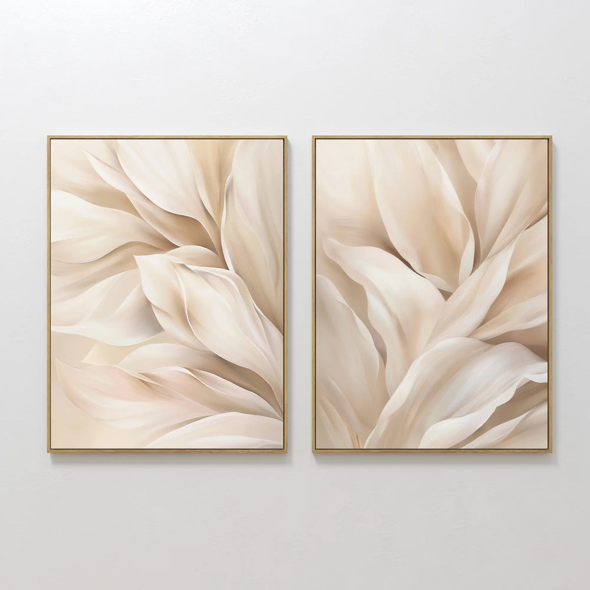 The Natural Texture Set of 2 features framed abstract art with soft beige and cream petal shapes on a light background, adding a calm, gentle movement to your space when displayed side by side on any wall.