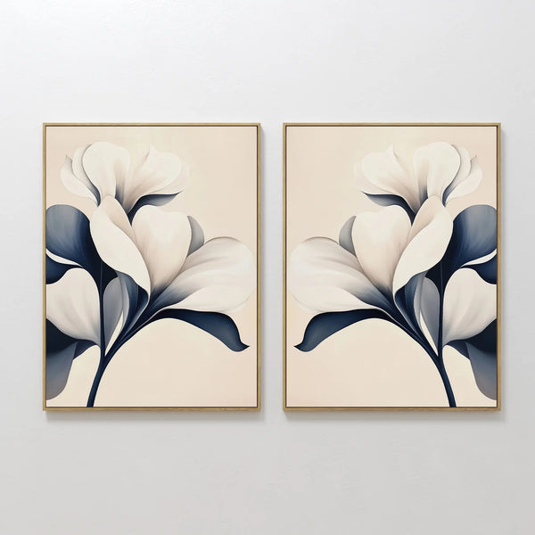 The Navy Magnolia Set of 2 features framed abstract white magnolia flowers with dark blue leaves on light beige backgrounds, creating striking modern floral wall art perfect for any room.