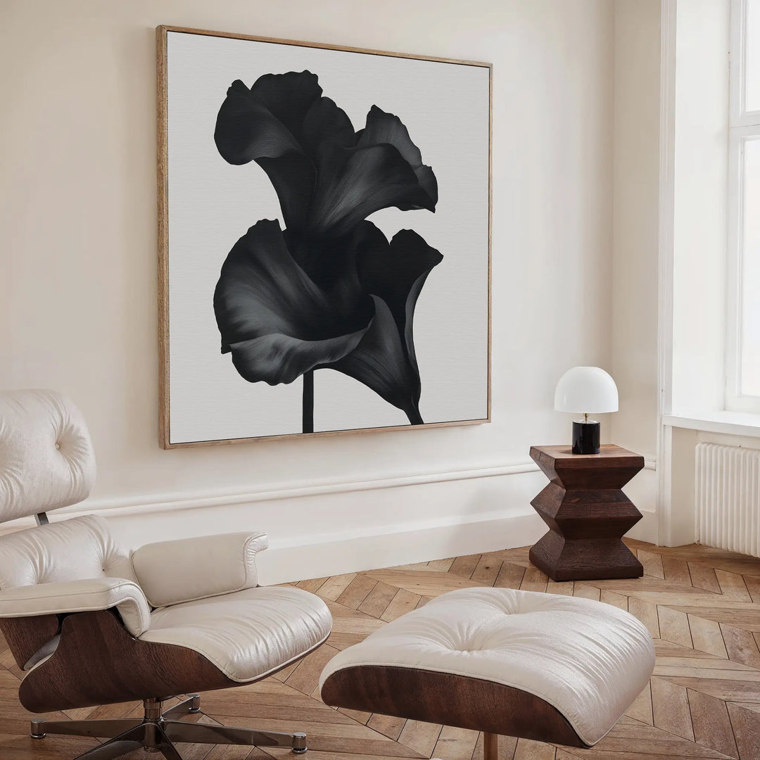 A modern living room decor featuring the Noir Bloom Canvas Art - Square as the focal point.
