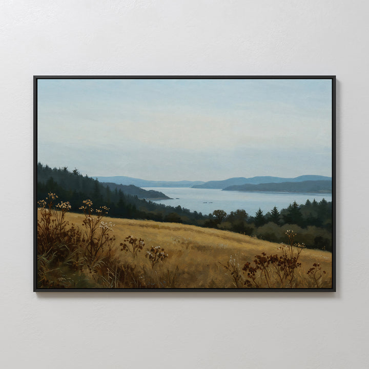 The Northern Silence Canvas Art features a serene landscape with a grassy field, wildflowers, trees, and calm water with blue hills—ideal minimalist wall art to enhance your living room decor.