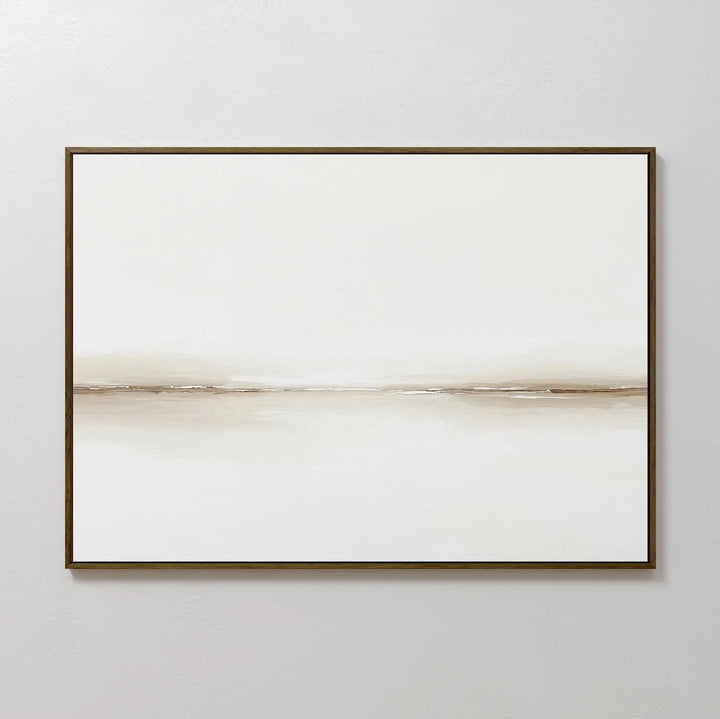 Pale Desert Canvas Art showcases a minimalist, horizontal beige line on a white canvas in a slim dark frame—ideal for contemporary living room decor and perfect on light grey walls.