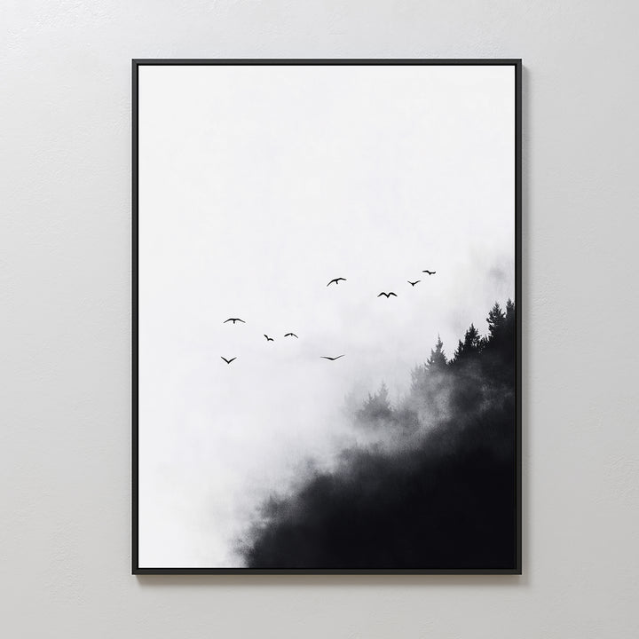 Passing Pines Canvas Art features a minimalist black-and-white forest with dark trees, mist, and soaring birds, framed in a simple black border. It creates a stunning contrast on any white wall.