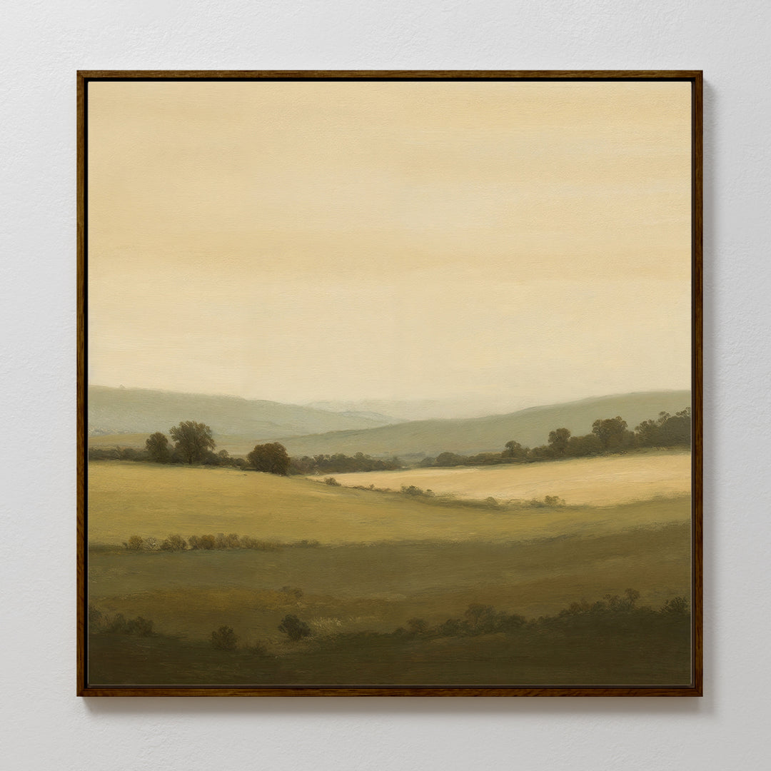 Quiet Countryside Canvas Art features a serene rural landscape with rolling green hills and a soft, pale sky, bringing calming minimalist wall art to any plain white wall.