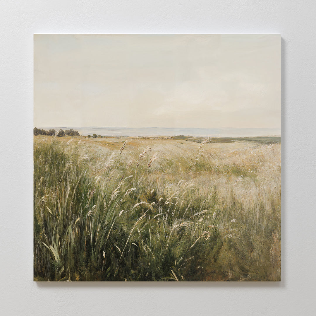 Reeds by the River Canvas Art features a serene grassy meadow under a pale sky with wild reeds in the foreground and distant trees, ideal as minimalist wall decor for a calm, natural living room.