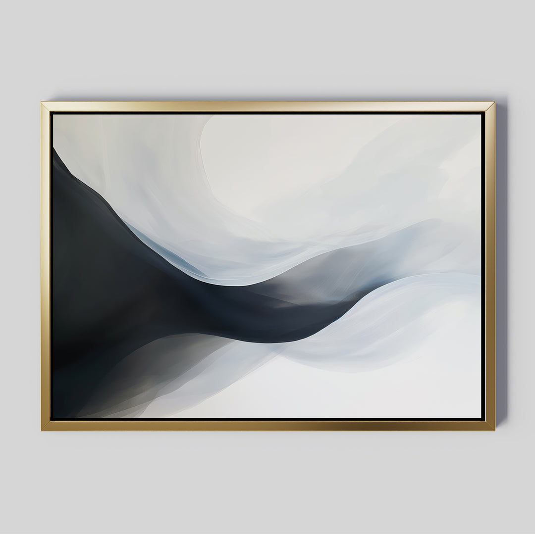 Rippling Vista Abstract Canvas Art features flowing black, gray, and white shapes on a light background in a gold frame. This minimalist piece adds modern elegance to pale gray walls.