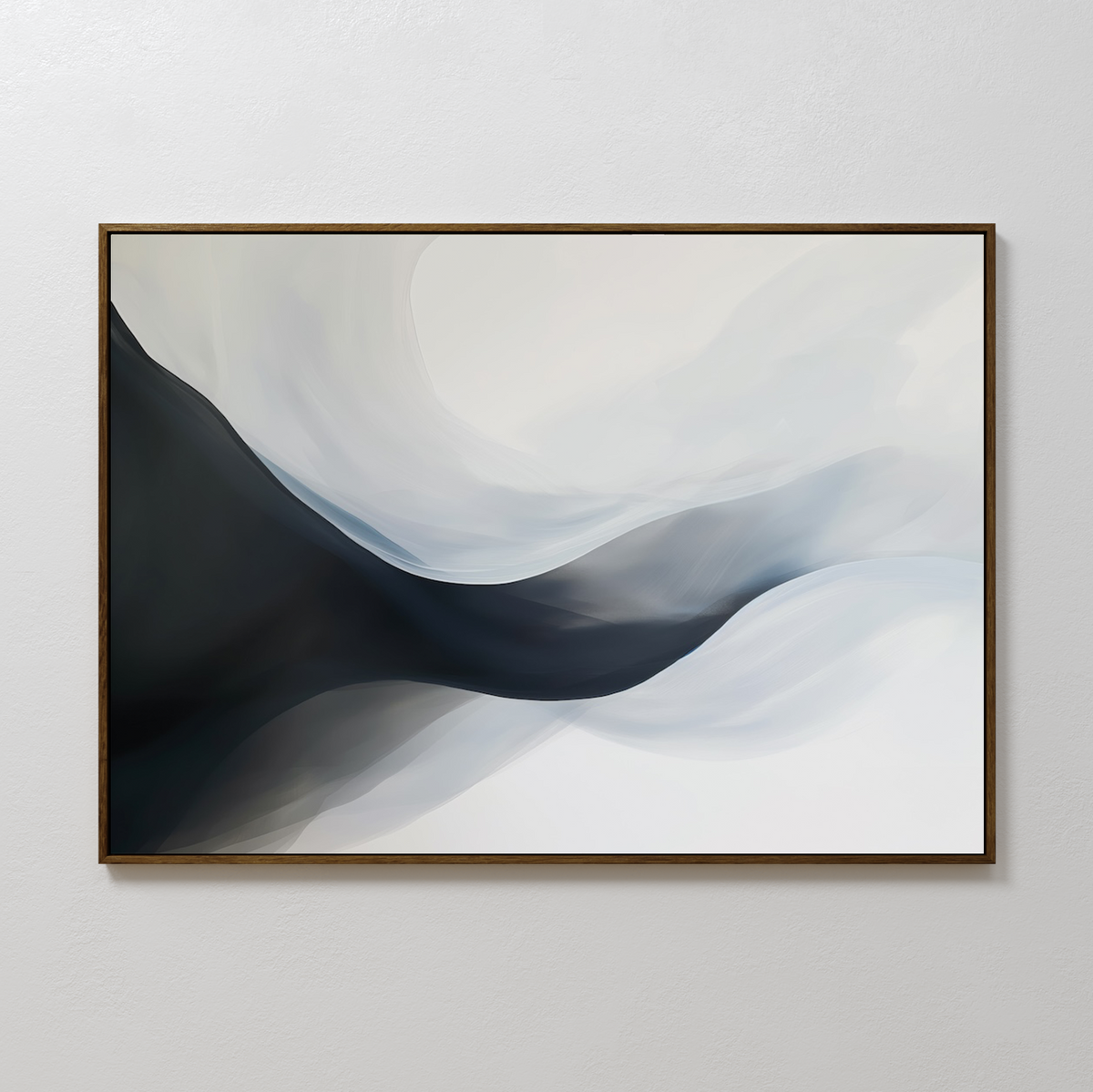 Rippling Vista Abstract Canvas Art features smooth, flowing shapes in black, gray, and white, evoking misty waves or mountains. This minimalist piece comes framed in a thin, dark frame and is ideal for display on a plain white wall.