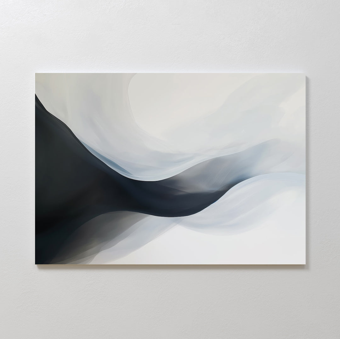 Rippling Vista Abstract Canvas Art features smooth, flowing shapes in black, gray, and white, creating a sense of movement and depth. This minimalist piece adds modern elegance to any space and looks stunning mounted on a pale wall.