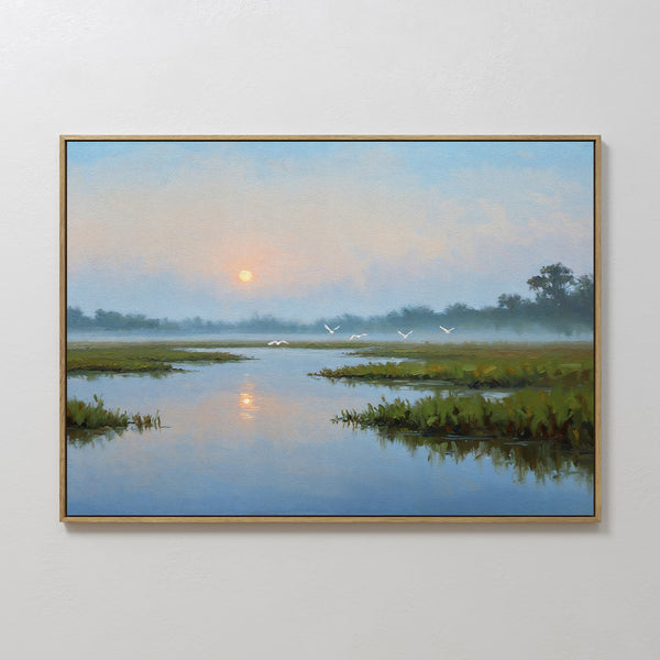 Rising Stillness Canvas Art is a framed minimalist wall piece depicting a serene marsh at sunrise with shimmering water, misty skies, and birds—an ideal way to bring peaceful beauty to your bedroom decor.
