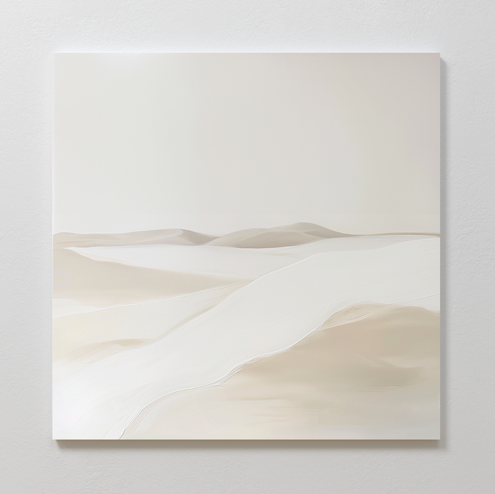 The Misty Vale Abstract Canvas Art, featuring soft beige and cream sand dunes, hangs on a white textured wall for a calm, airy vibe—ideal minimalist wall art for living room or bedroom decor.