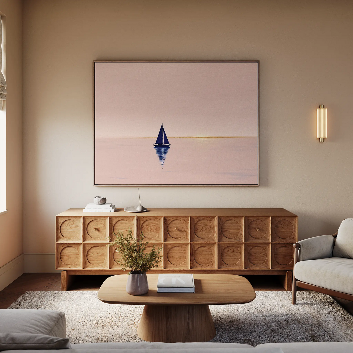 A cozy living room features light walls, a beige sofa, wooden coffee table, elegant sideboard, and calming wall art—a large Rose Harbor Canvas Art—creating serene modern decor.