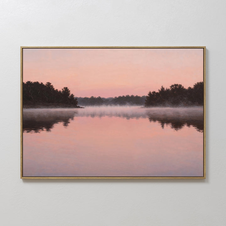 The Rose Lake Canvas Art features a serene sunrise with mist above calm water and soft pink skies. Minimalist bedroom decor, showcasing trees’ silhouettes mirrored in the tranquil lake for a peaceful ambiance.