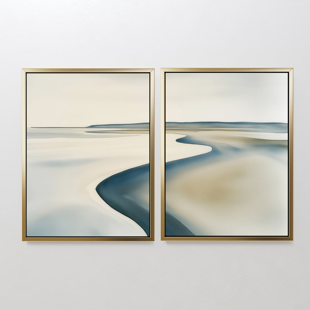 The Serene Coastline Set of 2 features abstract landscape paintings in gold frames, with soft beige, blue, and gray tones that evoke coastal wall art and bring minimalist elegance to any space.
