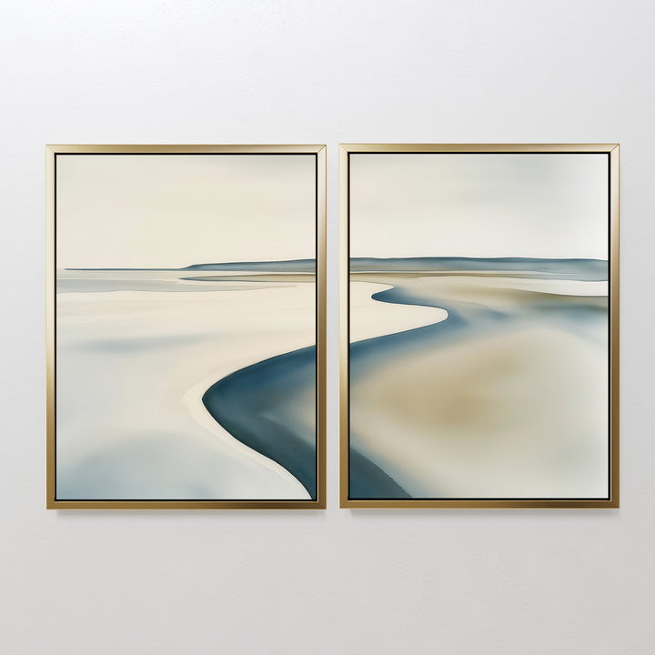 The Serene Coastline Set of 2 features abstract landscape paintings in gold frames, with soft beige, blue, and gray tones that evoke coastal wall art and bring minimalist elegance to any space.