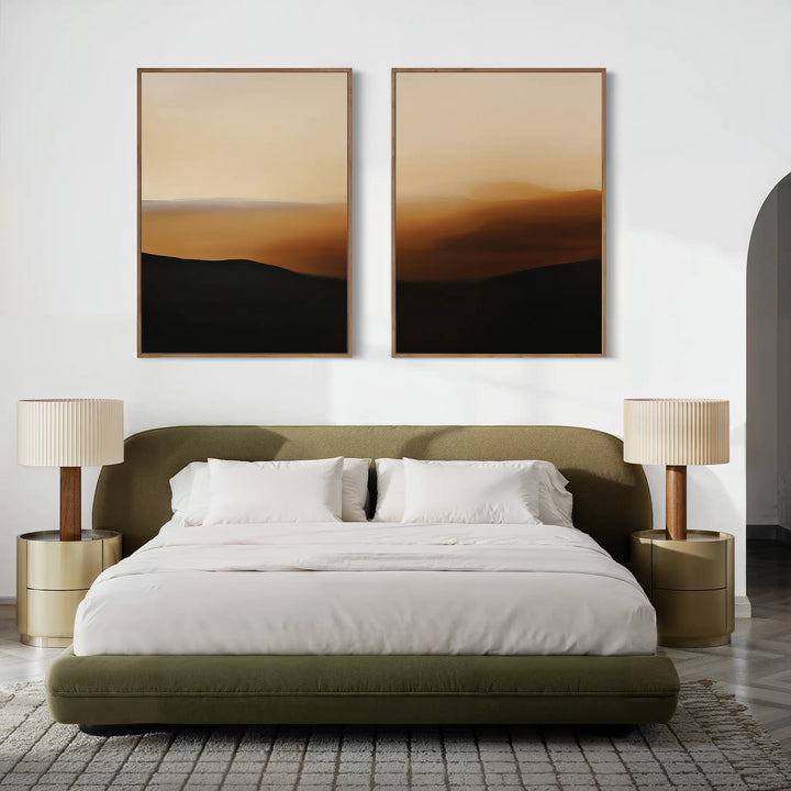 A modern bedroom featuring an olive-green upholstered bed, white bedding, and two Sienna Echo Set of 2 gold nightstands with pleated lamps. Neutral rug and warm-toned landscape art complete the look—great inspiration for living room decor too.