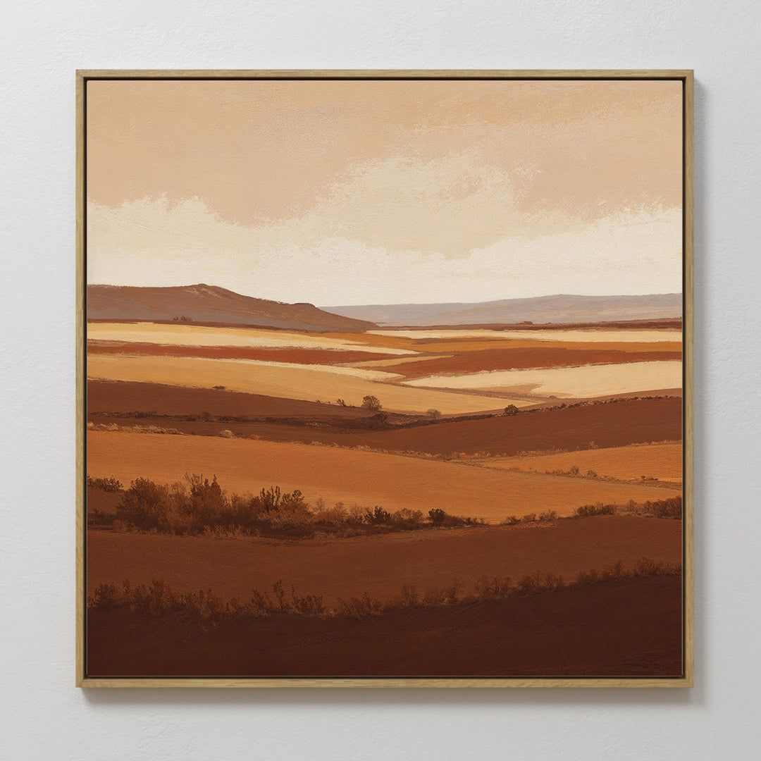 The Sienna Terrain Canvas Art showcases a framed landscape of rolling brown and beige hills beneath a cloudy sky, using warm earth tones for a calming, Nordic Park-inspired look—perfect wall art for peaceful, natural vibes.