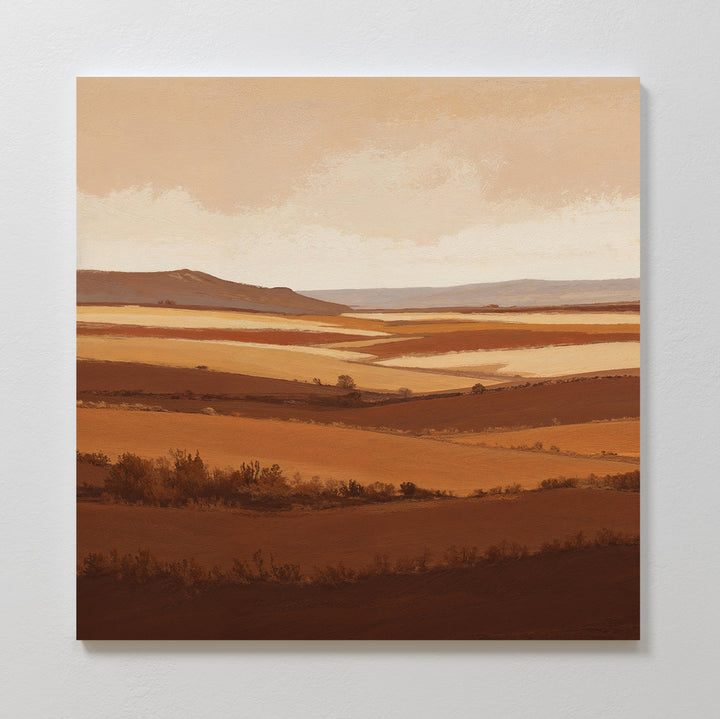 The Sienna Terrain Canvas Art features rolling hills and fields in warm brown and beige tones beneath a soft sky, capturing an earthy, layered landscape thats perfect for creating a calming Nordic Park vibe in your space.