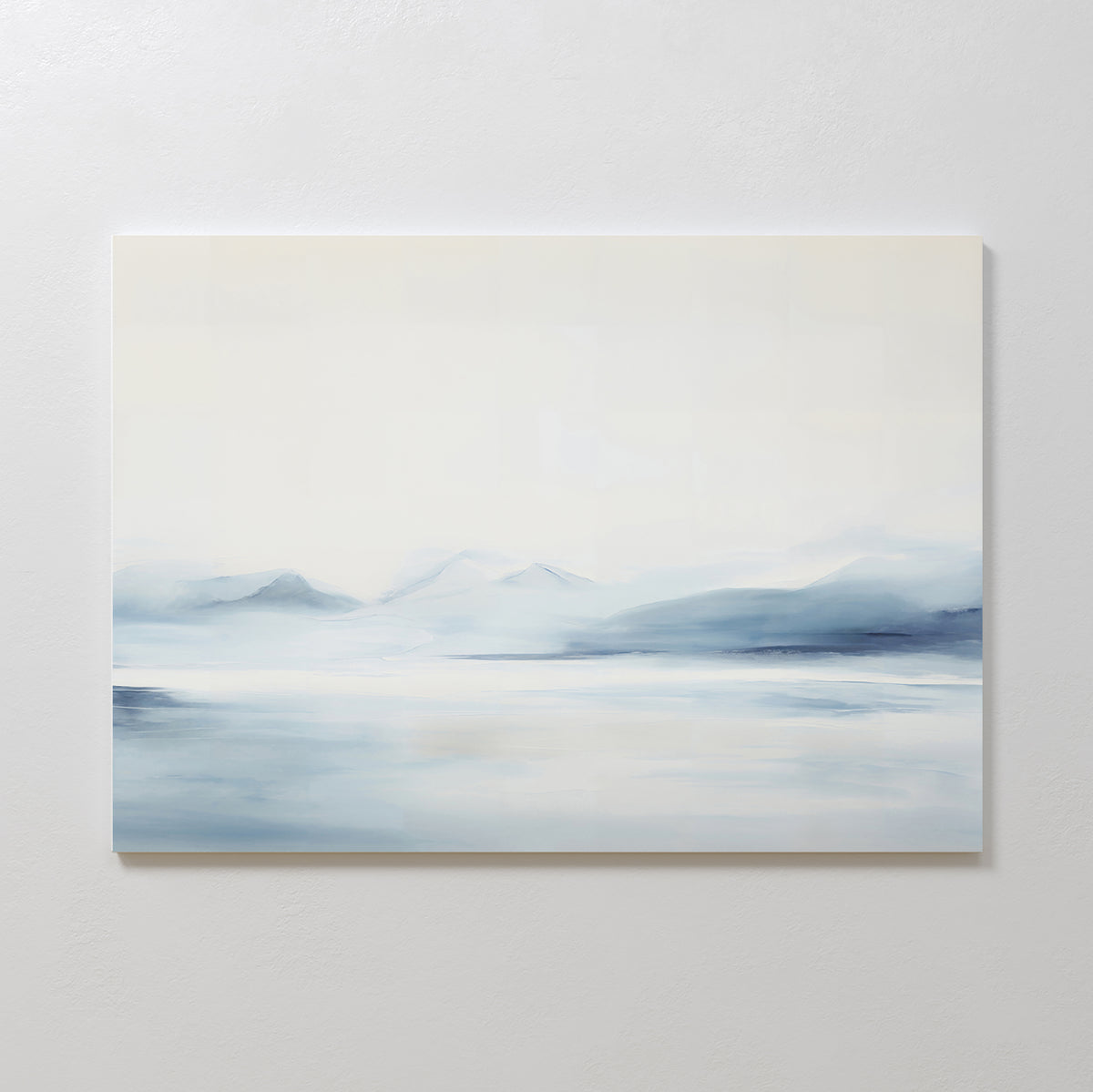 Silent Glaciers Canvas Art showcases minimalist blue-gray mountains mirrored in calm water beneath a pale, cloudy sky, with soft edges that evoke a serene and tranquil mood—ideal for creating a peaceful atmosphere in any space.