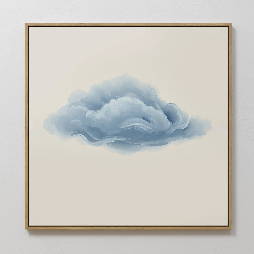 Single Cloud Canvas Art features a framed painting of a fluffy blue-gray cloud on a beige background, bringing modern minimalist style and a soft accent to any white wall.
