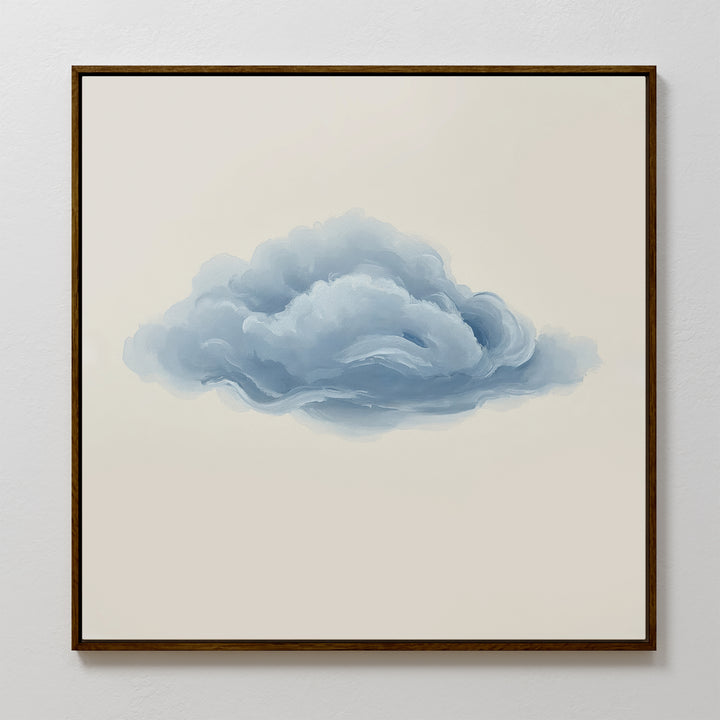 The Single Cloud Canvas Art displays a fluffy blue-gray cloud on a beige background, framed and perfect for adding minimalist charm to modern decor. Looks elegant when displayed on a white wall.