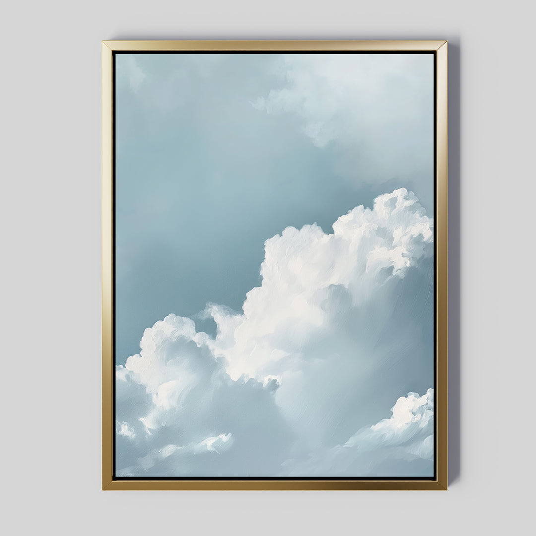 Sky Serenade Abstract Canvas Art features fluffy white clouds on a soft blue sky, set in a sleek gold frame. Displayed as minimalist wall art on a light gray wall, it’s perfect for modern living room decor.