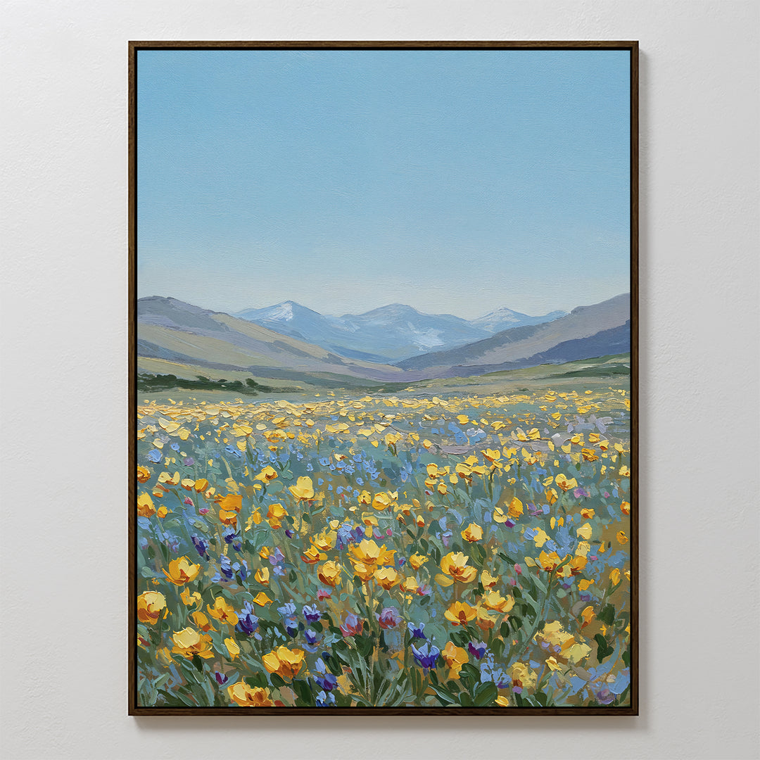 Skyview Field Canvas Art features a vibrant wildflower meadow with yellow, orange, and purple blooms beneath a blue sky and distant mountains—ideal large wall art to add color and charm to your bedroom decor.