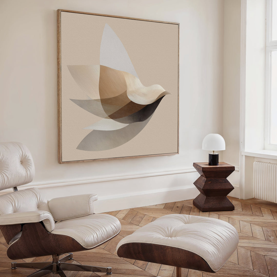 A modern living room features a white leather lounge chair and ottoman, wooden side table with a white lamp, parquet wood flooring, large windows, and minimalist wall art—Soaring Stillness Canvas Art above the seating area.