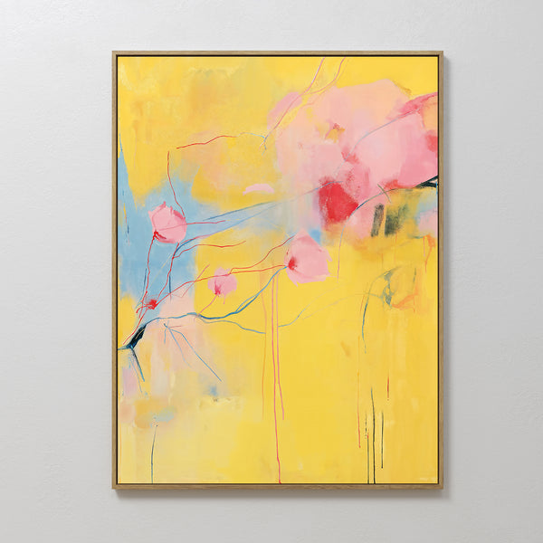 Soft Bloom Abstract Canvas Art features a yellow background with soft pink and blue floral-inspired shapes, framed in gold and displayed on a white wall—ideal as vibrant wall art for your living room decor.