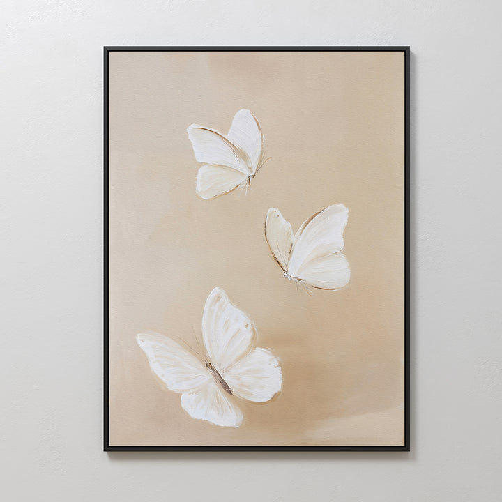 Linen Wings Canvas Art showcases three white butterflies with delicate wings on a soft beige backdrop—an elegant framed wall decor perfect for Nordic Park-inspired spaces.