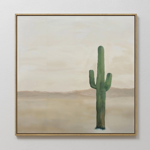 Solitary Rise Canvas Art showcases a tall green cactus in a serene desert with soft brown mountains and a muted sky—ideal for minimalist or living room decor.
