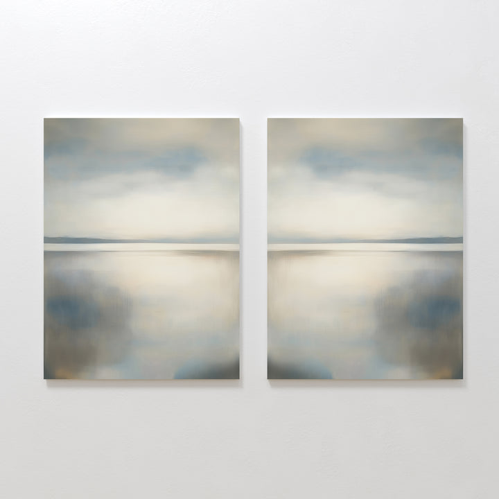 The Still Horizon Set of 2 features abstract landscape paintings with soft blue, gray, and beige tones, evoking a serene shoreline and minimalist vibe—ideal wall art for creating a calm, reflective atmosphere in your space.