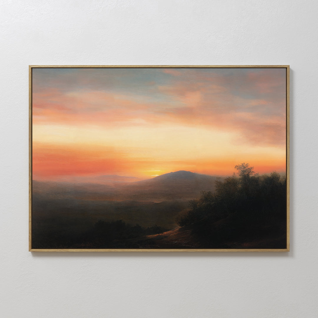 Sunset Reflection Canvas Art features a framed serene landscape with a colorful sunset sky, distant mountains, trees, and a winding path—perfect sunset wall art for any plain white wall.