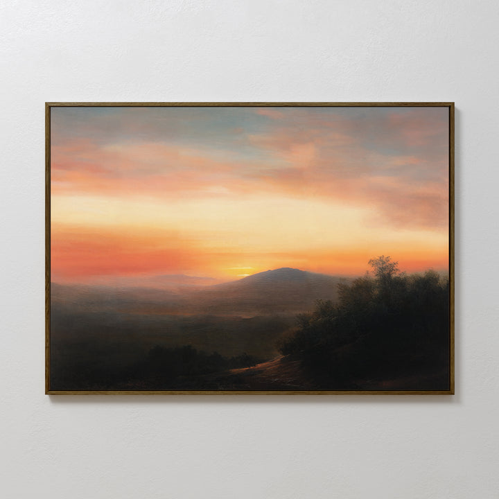 Sunset Reflection Canvas Art: A framed wall decor featuring a serene landscape with distant hills in warm orange and pink hues, and a dark foreground of trees—perfect vintage-inspired artwork for any space.