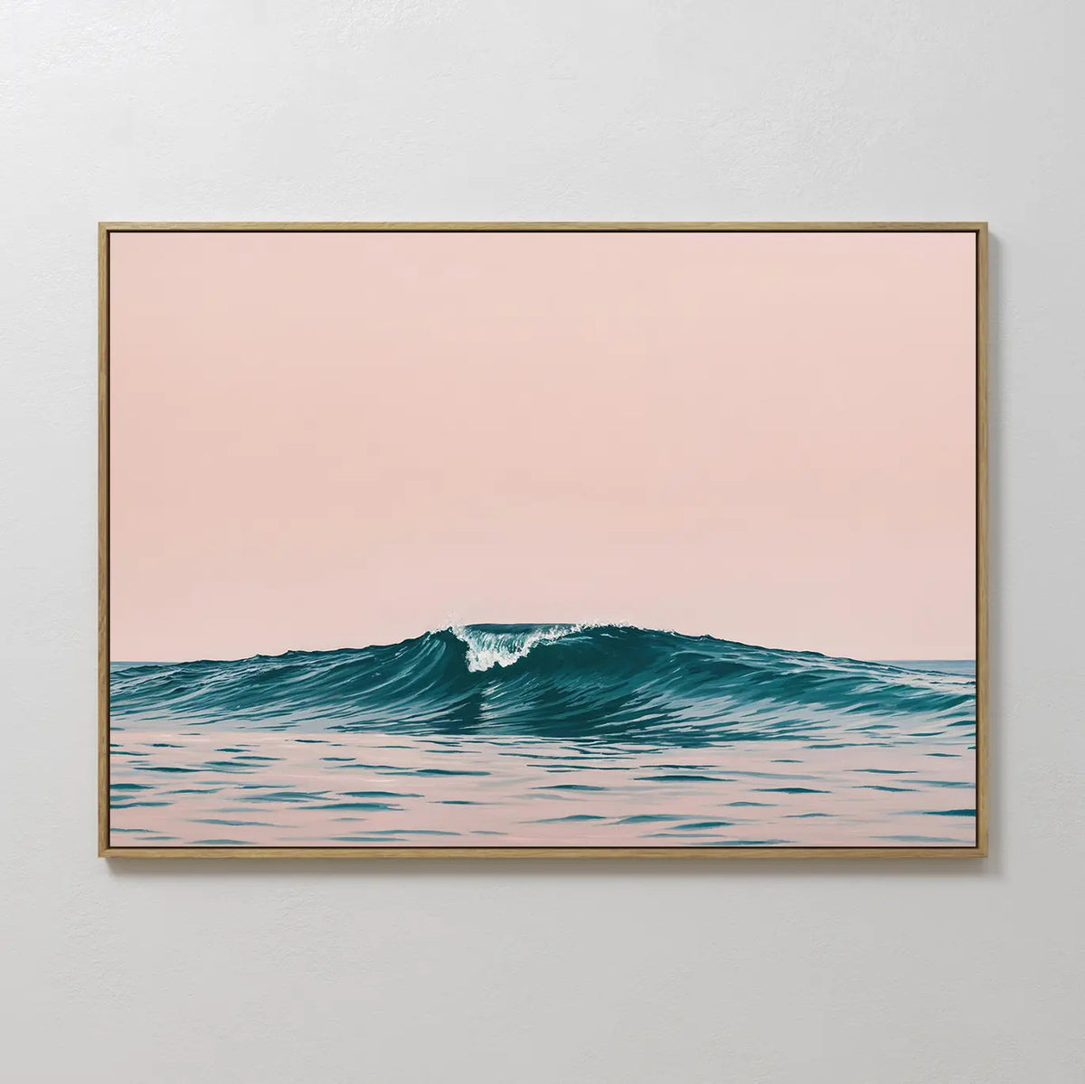 The Sunset Wave Canvas Art features a minimalist blue ocean wave beneath a pale pink sky, set in a pastel color palette. This framed print brings serene coastal style and calm vibes to any plain white wall.