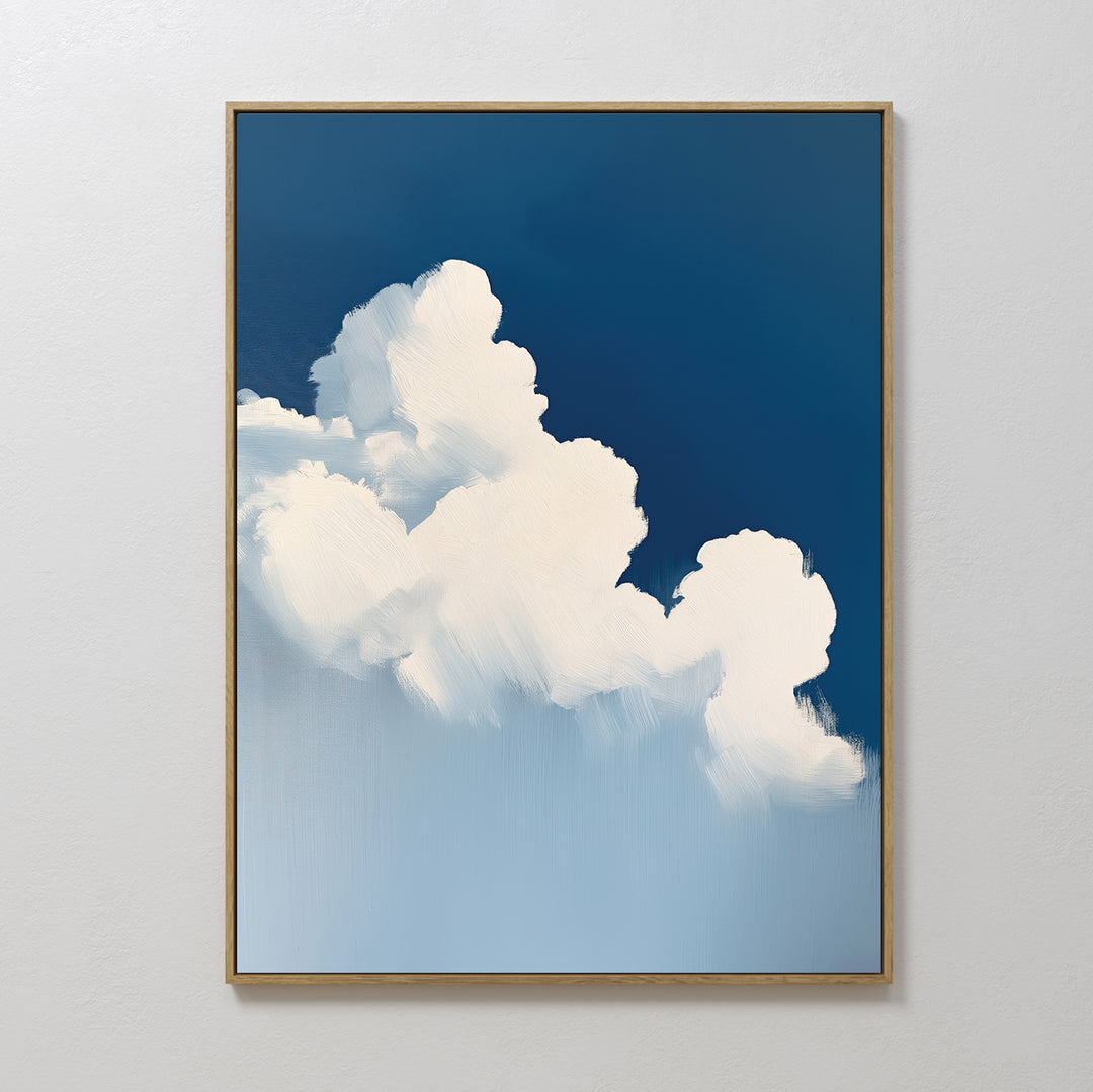 The Cumulus Abstract Canvas Art, a framed minimalist piece featuring fluffy white clouds against a deep blue sky, offers a calming decor accent with its soft clouds and smooth gradient, perfect for adding serenity to any space.