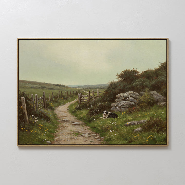 The Watchful Path Canvas Art features a rural landscape with a stone path, wooden fence, grassy hills, wildflowers, and a black and white dog—ideal countryside wall art for rustic living room decor.