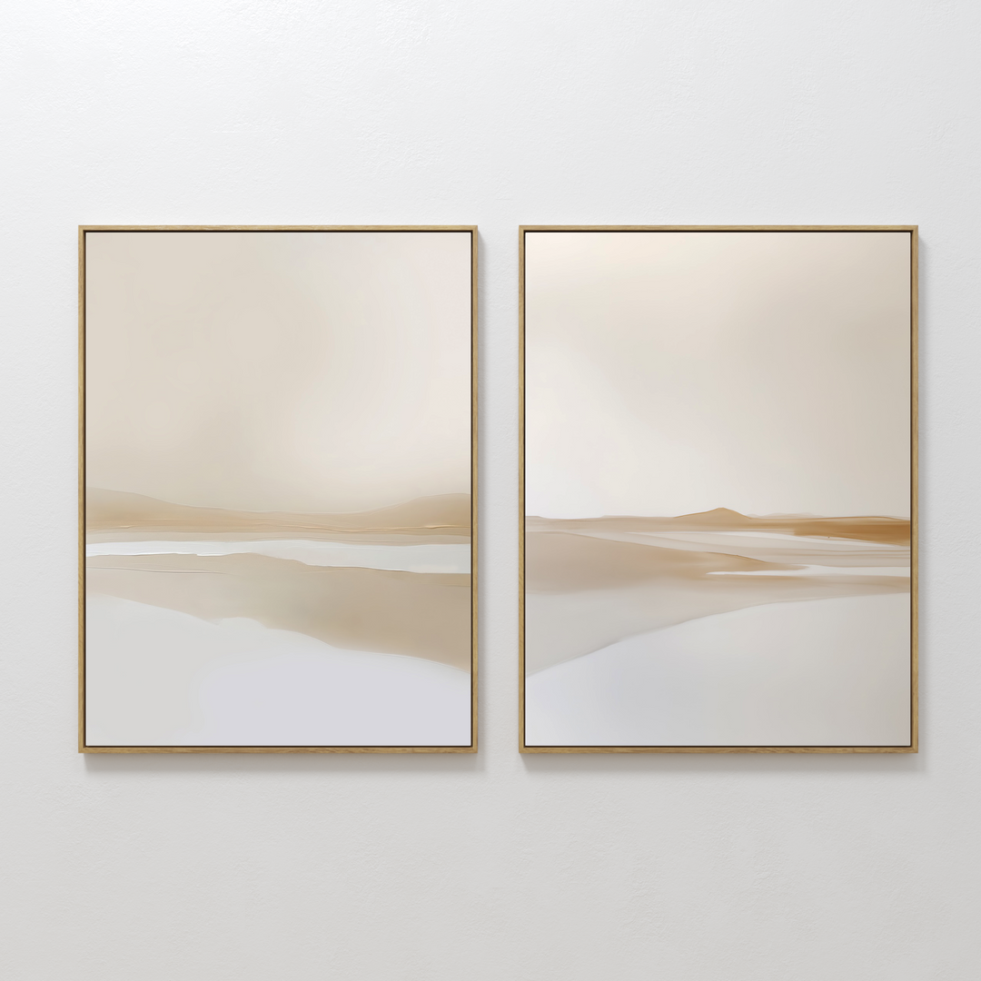 The Tranquil Horizons Set of 2 features minimalist framed abstract landscapes in soft beige, tan, and white tones, adding serene simplicity when displayed side by side on a white wall.