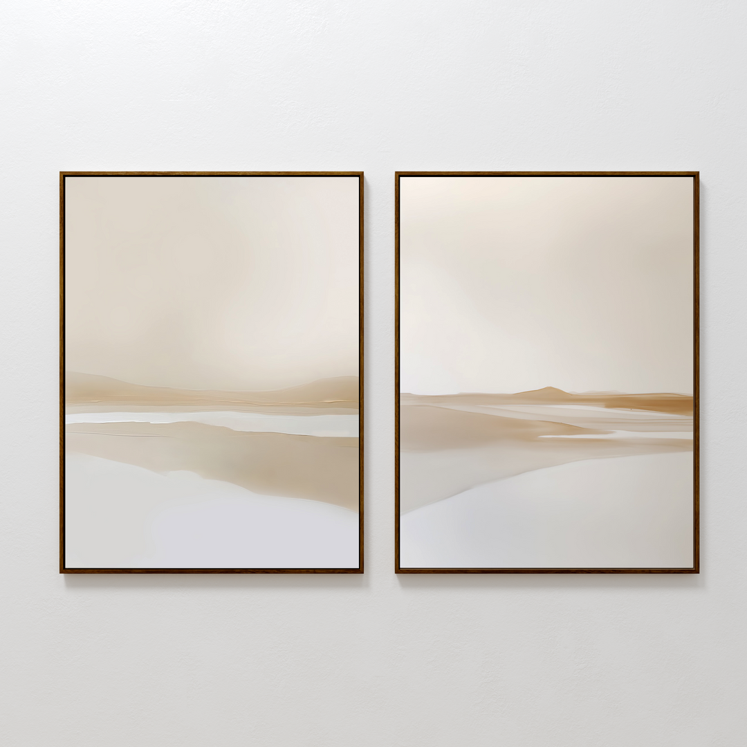 The Tranquil Horizons Set of 2 features framed abstract landscape paintings in soft beige, cream, and tan tones with blurred horizons, creating a calm, serene ambiance on any white wall.