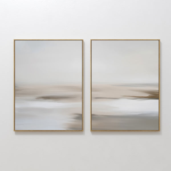 The Tranquil Shifts Set of 2 features framed abstract paintings in soft beige, gray, and white tones, evoking a serene landscape—perfect modern wall art for elegant living room decor.