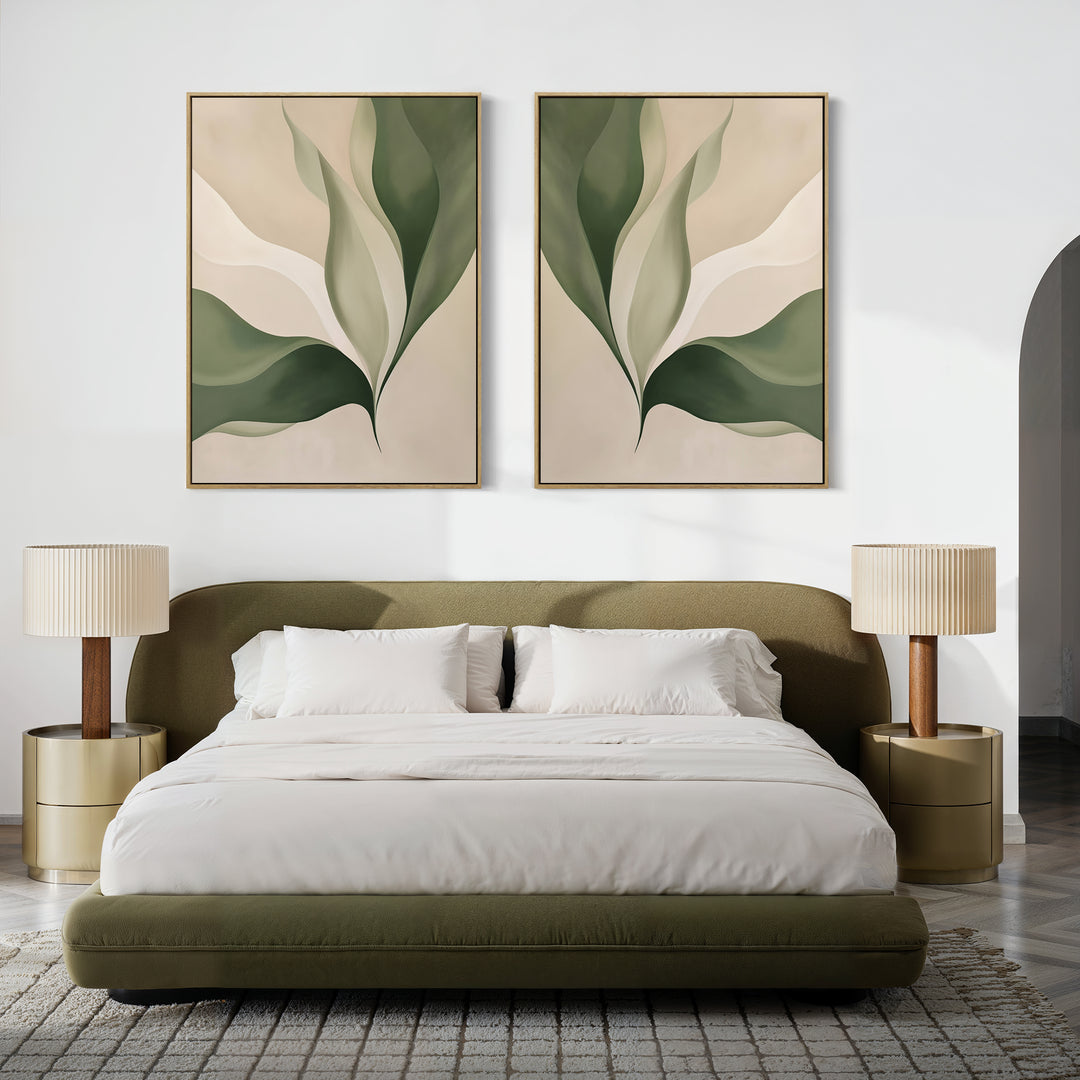 A modern bedroom features an olive green bed, white bedding, two round nightstands with beige lamps, and the Verdant Grace Set of 2—minimalist wall art with abstract green leaves—displayed above the bed.