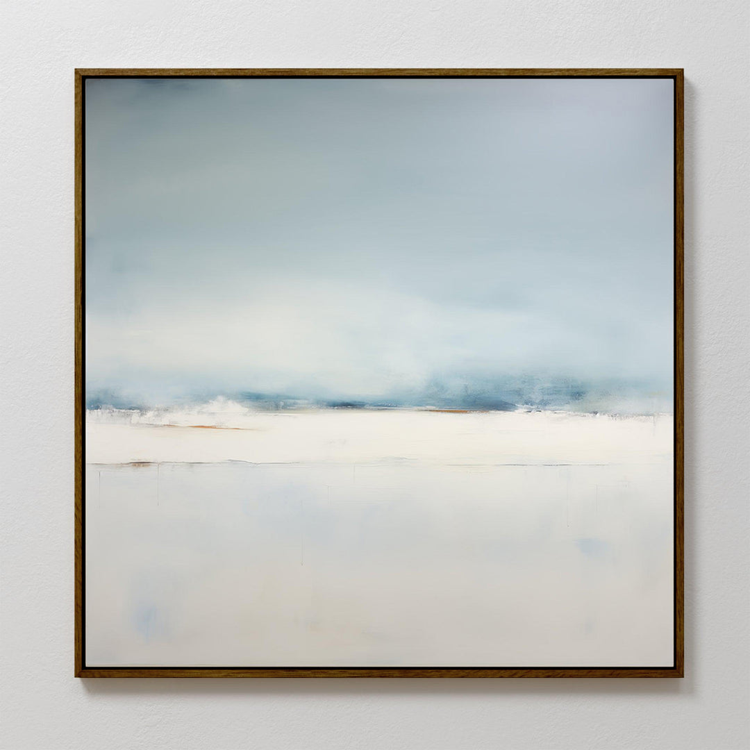 The Misty Morning Abstract Canvas Art features a soft gradient of pale blue, white, and beige evoking a serene sky over a calm landscape. This minimalist wall art is framed with a thin dark border, perfect for neutral home decor.